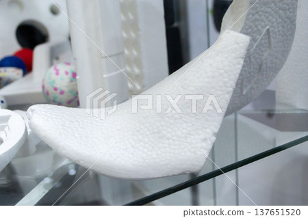 Foam plastic shoe mold. Products made from foamed polymers expanded polypropylene EPP and expanded polystyrene EPS. Model of dense and lightweight material, universal foam. New modern technologies Foam plastic shoe mold. Products made from foamed polymers expanded polypropylene EPP and expanded polystyrene EPS. Model of dense and lightweight material, universal foam. New modern technologies 137651520