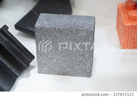 Products made from foamed polymers expanded polypropylene EPP and expanded polystyrene EPS. Model of dense and lightweight material, universal foam. New modern technologies. Industrial manufacturing Products made from foamed polymers expanded polypropylene EPP and expanded polystyrene EPS. Model of dense and lightweight material, universal foam. New modern technologies. Industrial manufacturing 137651523