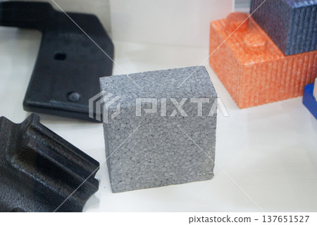 Products made from foamed polymers expanded polypropylene EPP and expanded polystyrene EPS. Model of dense and lightweight material, universal foam. New modern technologies. Industrial manufacturing 137651527