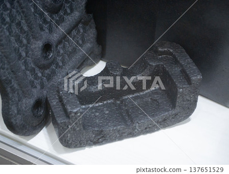 Products made from foamed polymers expanded polypropylene EPP and expanded polystyrene EPS. Model of dense and lightweight material, universal foam. New modern technologies. Industrial manufacturing 137651529
