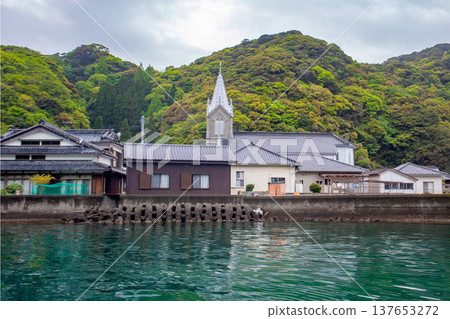 Sakitsu settlement in Amakusa, Kumamoto Prefecture: Catholic Sakitsu Church and townscape viewed from the sea. Sakitsu settlement in Amakusa, Kumamoto Prefecture: Catholic Sakitsu Church and townscape viewed from the sea. 137653272