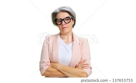 Mature woman wearing glasses feeling sad and thoughtful Mature woman wearing glasses feeling sad and thoughtful 137653753