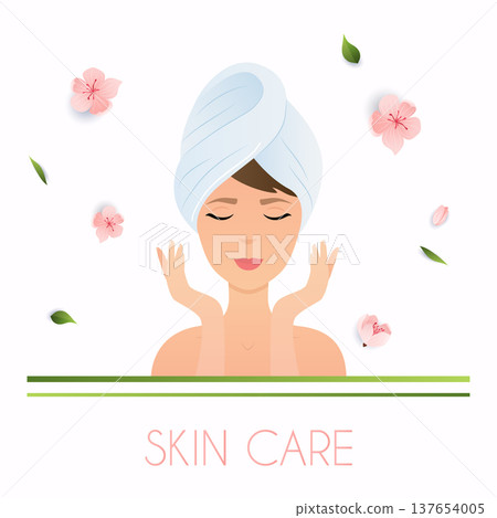 Young woman in towel with clean fresh skin touch own face. 137654005