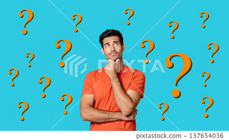 Man thinks deeply with question marks around him in a simple bright blue background Man thinks deeply with question marks around him in a simple bright blue background 137654036