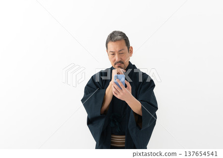 A man wearing a kimono 137654541