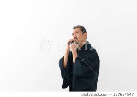 A man wearing a kimono A man wearing a kimono 137654547