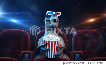 Dinosaur enjoys a movie night wearing 3D glasses and holding popcorn in a theater with red seats and dim lighting 137654784