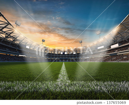 Stadium lights shine over the soccer field as the sun sets and fans gather for an exciting match 137655069