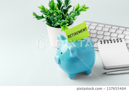 Financial goal for retirement concept, piggy bank and notebook on work desk, copy space Financial goal for retirement concept, piggy bank and notebook on work desk, copy space 137655484
