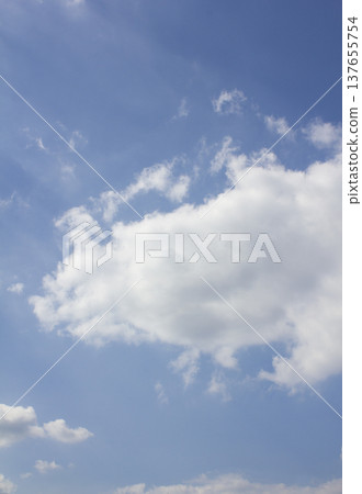 Blue sky with puffy clouds 137655754