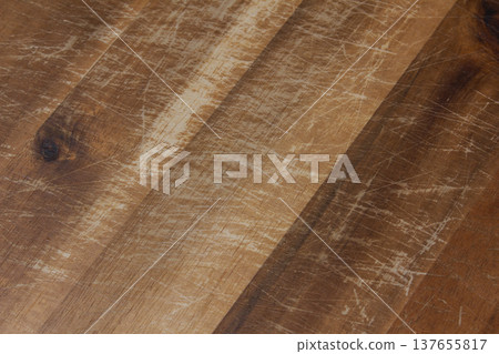 A close-up of an old wooden cutting board. A close-up of an old wooden cutting board. 137655817