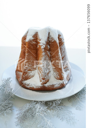 Pandoro on a white background: A traditional Christmas cake from Verona, Italy. Pandoro on a white background: A traditional Christmas cake from Verona, Italy. 137656099