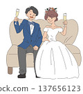 The bride and groom toast while sitting on the sofa. 137656123