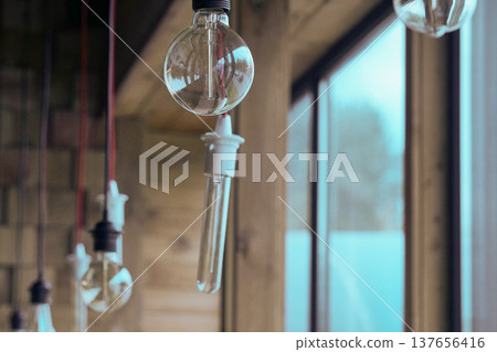 Vintage light bulbs suspended from a wire. Hanging retro incandescent lamps. closeup of photo Vintage light bulbs suspended from a wire. Hanging retro incandescent lamps. closeup of photo 137656416