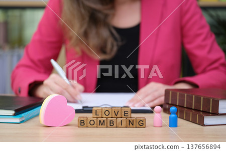 Exploring the concept of love bombing in a modern workspace during a creative brainstorming session Exploring the concept of love bombing in a modern workspace during a creative brainstorming session 137656894