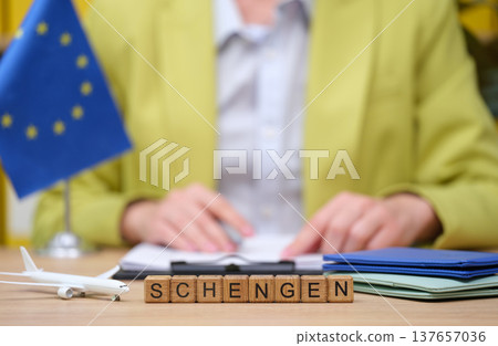 Exploring travel aspirations with Schengen in a vibrant office setting under bright European colors Exploring travel aspirations with Schengen in a vibrant office setting under bright European colors 137657036