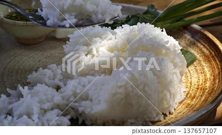 Cooked rice served in a plate. 137657107