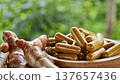 Herbal capsules containing turmeric powder in a wooden bowl. A natural anti-inflammatory dietary supplement. 137657436
