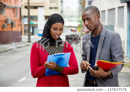 portrait of a man and a businesswoman. 137657576