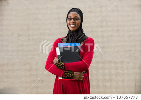 portrait of young muslim woman, smiling. 137657778