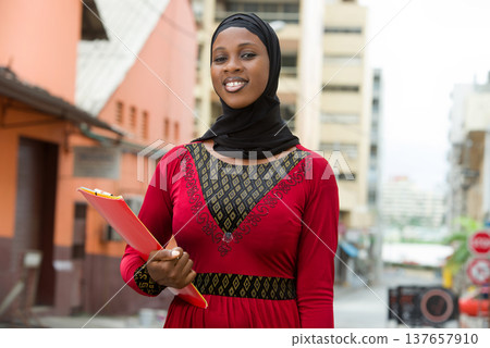 close up of muslim female, smiling. 137657910