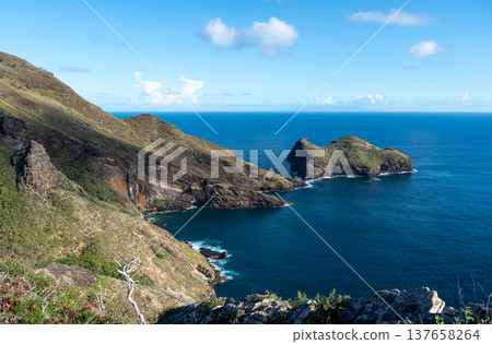 Cliffs and coastline of Taiohae Bay in Nuku Hiva, Marquesas Islands, French Polynesia 137658264