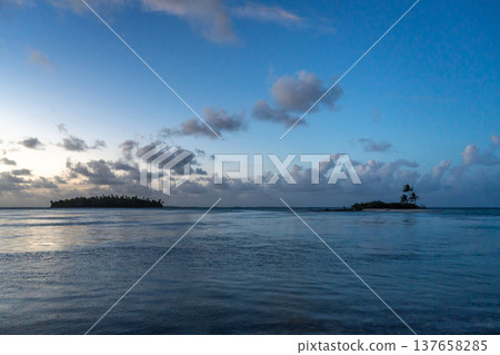 Sunset over two tropical motu on Tikehau Atoll, French Polynesia Sunset over two tropical motu on Tikehau Atoll, French Polynesia 137658285