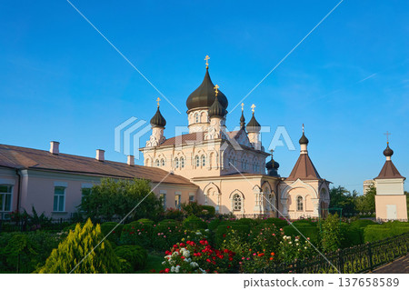 Ortodox women light monastery.Church in the sun rays 137658589
