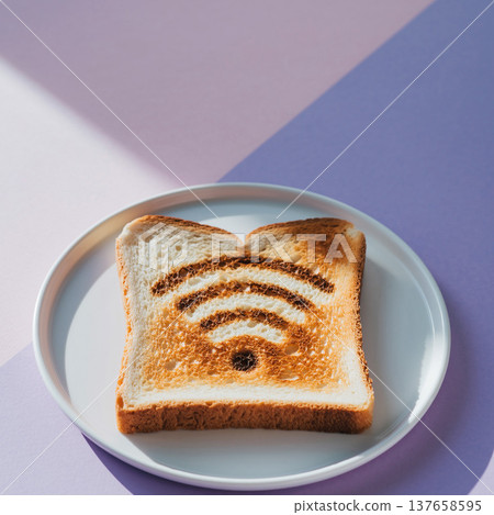 Slice of bread with a design resembling Wi-Fi symbol on a plate placed on a purple surface 137658595