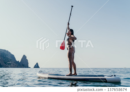 Woman Paddleboarding Ocean Stand Up Paddleboarding Woman Paddleboarding Ocean Stand Up Paddleboarding 137658674