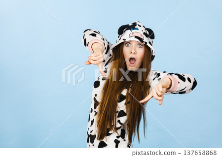 Woman wearing pajamas cartoon pointing down Woman wearing pajamas cartoon pointing down 137658868