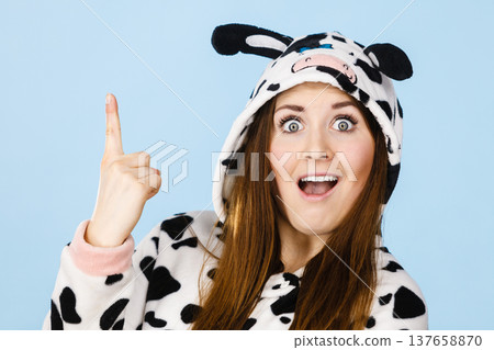 Woman wearing pajamas cartoon pointing up Woman wearing pajamas cartoon pointing up 137658870