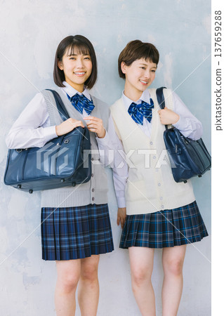 Smiling, close-knit high school girls Smiling, close-knit high school girls 137659288