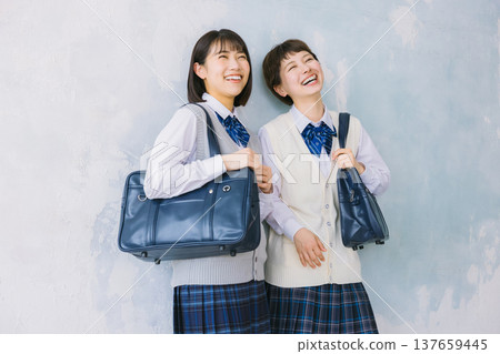 Smiling, close-knit high school girls Smiling, close-knit high school girls 137659445