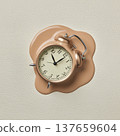 Clock melts on wall in a modern art display at an exhibition located in a gallery during the afternoon 137659604