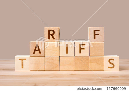 USA trade fighting with world crisis concept. Word Tariffs label is on wooden cubes. Tariffs increasing, price going up, affected to baseline tariff, reciprocal tariffs, global economy. USA trade fighting with world crisis concept. Word Tariffs label is on wooden cubes. Tariffs increasing, price going up, affected to baseline tariff, reciprocal tariffs, global economy. 137660009