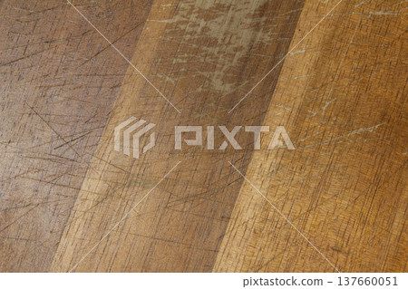 A close-up of an old wooden cutting board. A close-up of an old wooden cutting board. 137660051