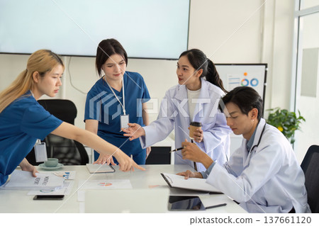 Medical Team Engaged in Collaborative Strategy Session 137661120