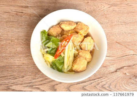 fried white garlic chive with slice yellow egg tofu and chili on bowl fried white garlic chive with slice yellow egg tofu and chili on bowl 137661979