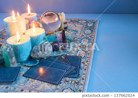 Divining future with lit candles and tarot cards 137662024