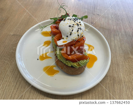 a plate with a salmon sandwich and a egg on it a plate with a salmon sandwich and a egg on it 137662450