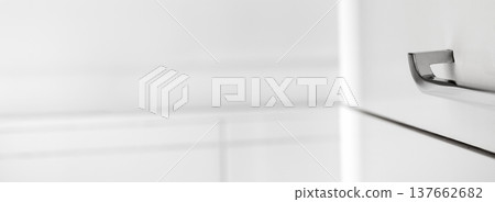 Minimal white dresser detail with metal handle and copy space 137662682