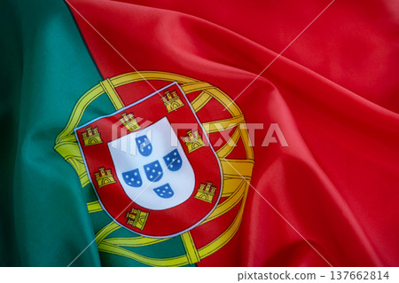 Portuguese flag, showcasing the vibrant green and red fields with the national coat of arms Portuguese flag, showcasing the vibrant green and red fields with the national coat of arms 137662814