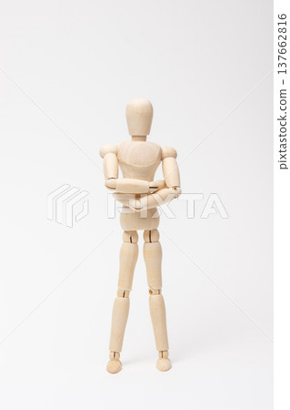 A drawing mannequin standing with its arms crossed, looking imposing. A drawing mannequin standing with its arms crossed, looking imposing. 137662816
