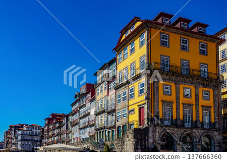 Colorful historic buildings in the Ribeira district of Porto's old town, Portugal. Colorful historic buildings in the Ribeira district of Porto's old town, Portugal. 137666360