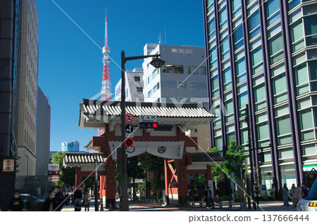 Shiba Daimon and the Cityscape: The historic Daimon, the main gate of Zojoji Temple, the head temple of the Jodo sect, stands amidst the modern skyscrapers of Tokyo. Shiba Daimon and the Cityscape: The historic Daimon, the main gate of Zojoji Temple, the head temple of the Jodo sect, stands amidst the modern skyscrapers of Tokyo. 137666444
