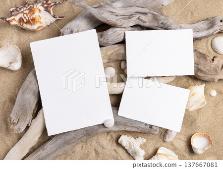 Blank cards mockup on sand with seashells and driftwood, beach wedding and summer event template 137667081
