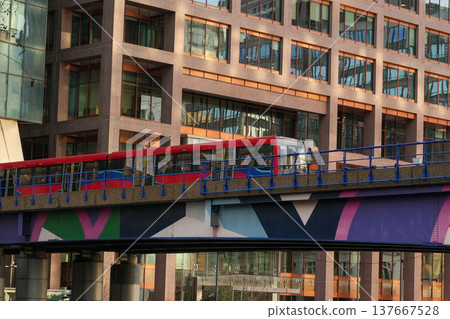 DLR train running through the skyscrapers of Canary Wharf, London's financial district. DLR train running through the skyscrapers of Canary Wharf, London's financial district. 137667528