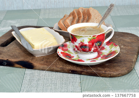 A cup of tea is on the table. 137667758
