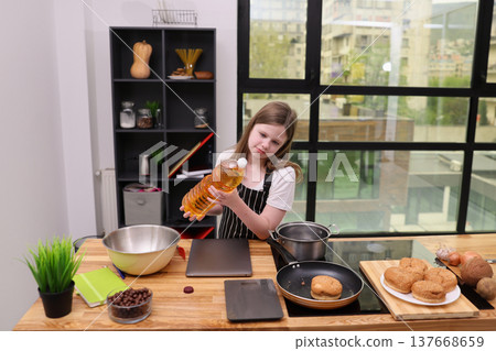 Young chef prepares a delicious meal in a bright, modern kitchen while exploring culinary skills Young chef prepares a delicious meal in a bright, modern kitchen while exploring culinary skills 137668659